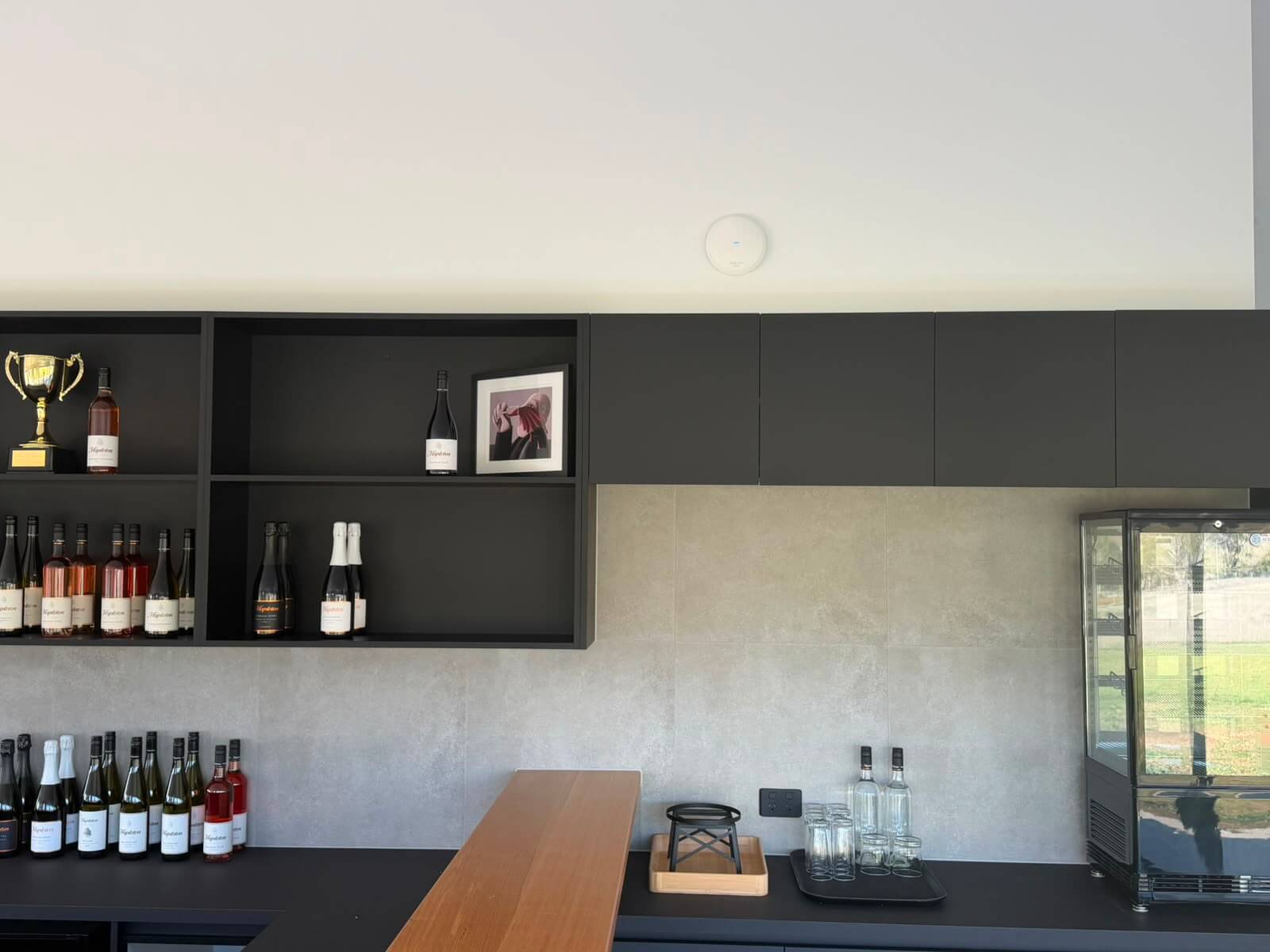 Ruijie Reyee WiFi 6 ceiling access point installed above the tasting bar at Mapleton Vineyard cellar door, Tea Tree