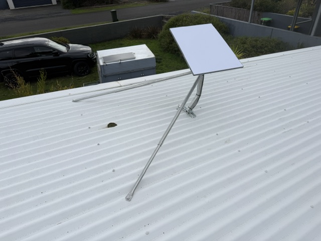 Starlink dish on a cranked pole mount with brace on a roof in Grove, Tasmania