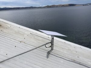 Starlink dish on a braced roof mount at a waterfront home in Southport, Tasmania