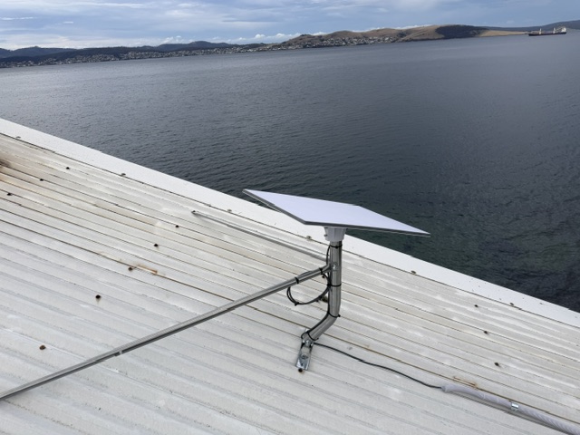 Starlink dish on a braced roof mount at a waterfront home in Southport, Tasmania